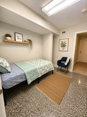 Bright single bedroom with reading chair